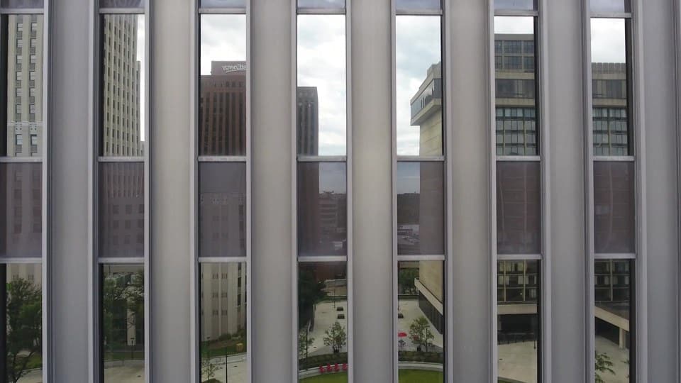 Slater & Zurz website design: a frame from the 2017 homepage video, the camera rising up the side of an office tower